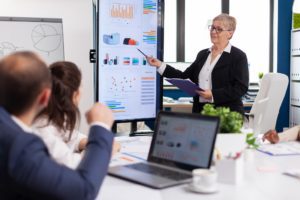 Experienced senior woman CEO CTO of start up company sharing financial reports